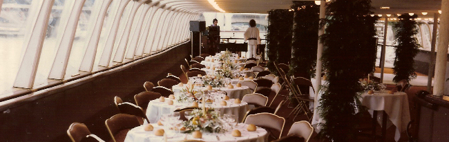 Image of dining tables set out on Nomadic's enclosed upper deck as a restaurant 