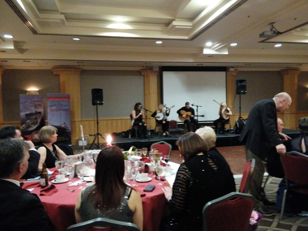 Musicians playing on stage to accompany the dinner